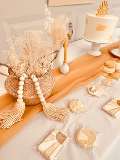 a table topped with cookies and desserts on top of a white table cloth