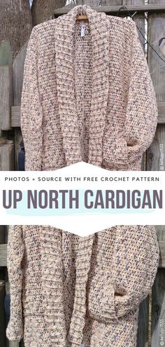 an up north cardigan is hanging on a fence