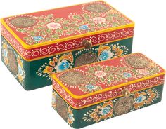 two colorful boxes sitting next to each other on top of a white surface with floral designs