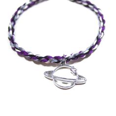 Show your asexual pride with this twist friendship bracelet with a Saturn charm! This minimalist bracelet in purple, white, gray, and black - the colors of the ace flag - is easy to adjust to your wrist or ankle. Hypoallergenic Purple Friendship Bracelets, Twist Friendship Bracelet, Saturn Charm, Adjustable Friendship Bracelet, Asexual Flag, Ace Flag, Twist Bracelet, Lgbtqia Pride, Ace Pride