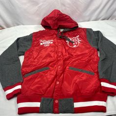 Brand New In With Tags The Hundreds X Drawing Lines Reloaged Sp 13 Varsity Jacket Size: Men's Medium Features: Vintage Letterman Retro Sport Styling Snap Front Closure Red Body With Grey Fleece Sleeves Adjustable Red Hood With Gray Fleece Lining And Drawstrings Embroidered White Adam Bomb Left Chest The Hundreds Drawing Lines 1980 Text Right Chest Huge Text In Rear 2 Front And 1 Inner Right Side Pockets Red & White Striped Rib Knit Cuffs And Hem Charcoal Lining Questions? Leave A Comment Below! Red Varsity Sports Outerwear, Red Nylon Hooded Jacket For Fall, Red Hooded Track Jacket For College, Casual Red Hooded Varsity Jacket, Retro Red Hooded Windbreaker, Red Hooded Varsity Jacket For Fall, University Red Hooded Winter Outerwear, Red Hooded Cotton Track Jacket, Hooded University Red Winter Outerwear