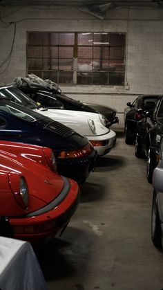 there are many cars parked in the garage