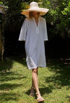 Eco friendly caftans and tunics inspired by the ocean, made on main street. Ethically sourced and locally made in Los Angeles. You asked, we delivered: A short version of our popular double gauze tunic dress. Simple, pared down, and easy, this is the ultimate 'throw-on-and-go' dress. Made in our soft, double gauze fabric, it drapes as beautifully as it launders. (It's hard to believe, but it gets softer and softer with each wash, and, it won't shrink). With pockets and a classic v neckline, this Breezy Cotton Gauze Dresses For Vacation, Breezy Cotton Gauze Vacation Dresses, Breezy Cotton Gauze Beach Dress, White Cotton Gauze Summer Dress, Beach Tunic Shift Dress, Casual Cotton Gauze Vacation Dress, Spring Cotton Gauze Beach Cover-up Dress, Bohemian Tunic For Daywear With Relaxed Fit, Beach Dresses With Relaxed Fit And Split Neck