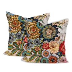 two decorative pillows with colorful flowers on them