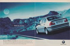 an advertisement for the new bmw 3 series sedan, with mountains in the back ground