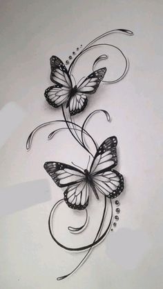 a drawing of two butterflies with swirls and bubbles