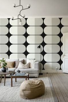 a living room with black and white wallpaper