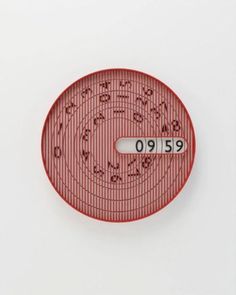 a red and white plate with numbers on it