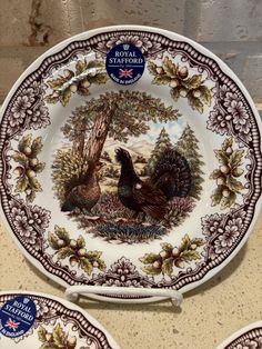 three royal stafford china plates with turkeys on them