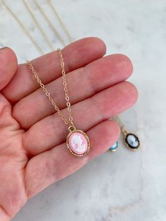 Gorgeous 15mm X 10mm cameo necklace on a 14k gold filled chain with 14k gold filled jumprings and clasp. Giftbox included. Choose from pink, black, or blue. Gold Cameo Necklace, Gold Cameo Jewelry, Pink Cameo, Blue Cameo, Black Cameo Cameo Round Pendant Necklace For Gift, Rose Gold Cameo Jewelry For Gifts, Cameo Round Pendant Necklace Gift, Rose Gold Cameo Jewelry Gift, Pink Cameo Jewelry As A Gift, Oval Gold Cameo Necklace, Yellow Gold Cameo Necklace Gift, Pink Cameo Necklace For Gifts, Antique Gold Cameo Pendant Necklace