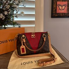 2019 Monogram V Tote Handbag With Red Leather, Inside The V & Surrounded By Monogram Canvas Is In Mint Condition Seen From The Pics. I’m Original Owner & Have Taken Exception Care Of It! Purchase Directly From Louis Vuitton At End Of 2019 And Have Used Once. I've Always Stored In Original Dust Bag. I Have The Receipt Somewhere But Unfortunately Have Been Unable To Locate But Still Wanted To List. Once/If I Do, I Will Forward To The Buyer. Bag Will Be Authenticated By Poshmark Before You Receive. Will Include Original Louis Vuitton Storage Bag (Box Not Included) Date Code: Ca1139 Measures- 10.25” L By 7.50” H /Handle Drop Is 3.5” / Strap Measures 19.75” To 22” Only Selling A Louis Vuitton Luggage Red, Pink And Brown Louis Vuitton Bag, Louis Vuitton Red Bag, Louis Vuitton Multicolor Bag, Louis Vuitton Brown Handbags, Tote Handbag, Handbag Purse, Monogram Canvas, Storage Bag