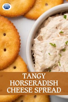 a bowl of horseradish and crackers on a plate with the words, tangy horseradish cheese spread