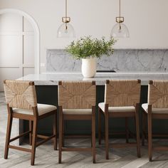 a kitchen table with four chairs and a plant in the center on top of it