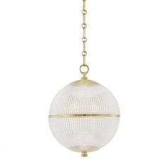 a white ball hanging from a gold chain