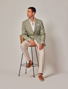 This exquisite green tailored fit suit jacket is woven in Italy in the Angelico mill from pure linen and it features a semi plain weave The lined, single breasted jacket is designed with a classic notched lapel with two front buttons The elegant double vents to enable freedom of movement Finer details include a felt lining under the collar of the jacket and working button cuffs Team with a white slim fit formal shirt and a patterned silk tie and pocket square for a sharp ensemble    Notch lapels   Breast pocket   Internal pockets   Mock horn buttons   Working button cuffs    100% linen Also available in matching trousers, part of green Italian linen suit  The model is wearing a size 38 jacket  Model is 6'1 / 186cm tall, with a 40 / 101 5cm chest and a 33 / 83 5cm waist Men’s Linen Suits, Mens Summer Wedding Attire Guest Casual, Sage Green Suit Wedding, Groom Summer Wedding Attire, Sage Linen Suit, Spring Suits For Men, Groom Linen Suit, Linen Groom Suit, Wedding Suit Summer