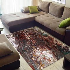 a living room with couches and a large painting on the floor in front of it