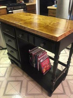 a kitchen island with some books on it