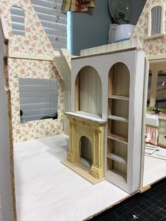 the doll house is made out of cardboard