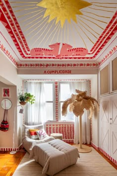 the ceiling in this room is decorated with red and white