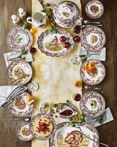 an overhead view of a table setting with plates and silverware on top of it