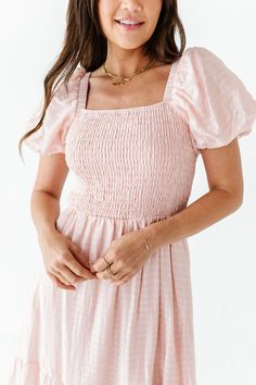 Features Square neckline Short puff sleeve with elastic Smocked bodice with stretch Elastic waist Bodice, sleeves, and skirt are lined Light pink with subtle textured gingham detail Pockets 84% Tencel, 16% Nylon; Lining: 100% Polyester Size + Fit Small 0-4, Medium 4-8, Large 8-12, X-Large 12-16, 1X 16-18, 2X 20-22, 3X 24-26 Kristin is 5'4", a size 1 and is wearing a Small Jaycie is 5'6" a size 18 and is wearing a 2X Runs true to size. Measurements taken while laying flat and then doubled. They d Light Pink Dresses, Sunday Dresses, Curvy Swim, Temple Dress, Light Pink Dress, Short Puff Sleeve, Curvy Dress, Gingham Dress, Clothes Ideas