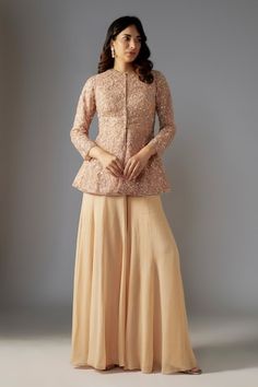 Beige peplum jacket with sequin bead embellished victorian swirl patterns. Comes with solid sharara. - Aza Fashions Embellished Long Sleeve Nehru Jacket For Designer Wear, Festive Long Sleeve Nehru Jacket With Sequins, Anarkali Style Long Sleeve Embellished Blouse Piece, Embellished Long Sleeve Nehru Jacket For Festive Occasions, Anarkali Sharara With Pearl Embroidery And Long Sleeves, Festive Long Sleeve Sharara With Handwork, Designer Long Sleeve Choli With Pearl Embroidery, Anarkali Long Sleeve Tops For Reception, Fitted Long Sleeve Sharara With Pearl Embroidery