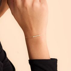 This lovely bezel bracelet gets 5 stars. You know what to choose when you need a tiny touch of diamond to your ensemble. F E A T U R E S * Made to Order. * Gold KT: 14K * Choice of Gold Color: Yellow Gold, Rose Gold, White Gold * Gem Stone: Genuine Diamond * Diamond-Cut: Round * Diamond Carat: 0.05 ct * Charm Height: 4 mm * Charm Width: 16 mm * Diamond Color-Clarity: H Color, SI Clarity * Chain length is adjustable from 6 to 7 inches. * Setting Type: Bezel Setting * Ready to Ship in 1-3 Business 14k Gold Dainty Bezel Set Bracelet, Minimalist 14k Gold Bracelets With Bezel Setting, Dainty 14k Gold Jubilee Diamond Bracelet, Minimalist 14k Gold Diamond Jubilee Bracelet, Minimalist Bezel Set Bracelet For Anniversary, Minimalist Bracelet With Bezel Setting For Anniversary, Diamond Bracelet For Women, Diamond Bar Bracelet, Bezel Bracelet