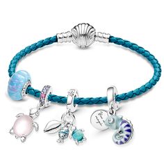 Summer is more fun with friends! From Pandora, this bracelet set begins with the Pandora Moments Seashell Clasp Turquoise Braided Leather Bracelet with a sterling silver shell-shaped clasp. Adorning the ocean-hued bracelet are four charms: an Opalescent Ocean Blue Charm with a spectrum of colors and streaks of glitter; a Murano Glass Pink Sea Turtle Dangle Charm, featuring a sterling silver cut-out pattern on the belly and pink & purple crystal detailing; a Fish, Sea Turtle & Conch Triple Dangle Cheap Blue Charm Bracelet For Women, Cheap Blue Charm Bracelet, Cheap Blue Charm Bracelet For Gift, Pandora Sea Shell Charm, Cheap Beach Charm Bracelet With Round Beads, Cheap Charm Bracelet For Beach In Summer, Cheap Summer Charm Bracelet For Beach, Cheap Summer Charm Bracelet Gift, Cheap Summer Gift Charm Bracelet