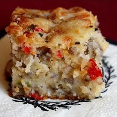 a close up of a piece of food on a plate with a napkin and fork