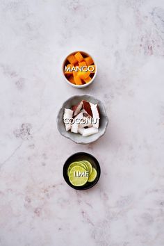 three bowls filled with food sitting on top of a white marble counter next to each other