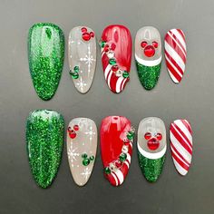 Celebrate the holidays with our Christmas Glitter Mouse Ears Press On Nails! These handmade, reusable nails feature festive red and green colors with cute mouse ear designs. Easy to apply, they're perfect for a fun, custom holiday look in both short and long styles! 🌸Thank you for supporting my small business.🌸 You can reuse all the nails you purchased from us multiple times, if you handle them with care 📦𝐖𝐡𝐚𝐭 𝐜𝐨𝐦𝐞𝐬 𝐰𝐢𝐭𝐡 𝐲𝐨𝐮𝐫 𝐩𝐫𝐞𝐬𝐬 𝐨𝐧 𝐧𝐚𝐢𝐥 𝐤𝐢𝐭? 10 𝘯𝘢𝘪𝘭𝘴 𝘰? Grinch Nails Almond Shape, Disney Christmas Nail Art Designs, Best Christmas Nail Designs, Short Christmas Nails Design, Minnie Christmas Nails, Christmas Peppermint Nails, Christmas Nail Designs Grinch, Christmas Green Nails Acrylic, Green Red Christmas Nails