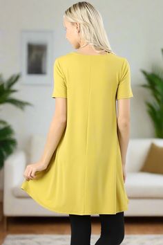 Brighten up your fall wardrobe with our yellow shift dress for Women, a versatile and comfortable piece perfect for any occasion. Made from buttery-soft, stretchy fabric, this short-sleeve dress offers a relaxed fit that moves with you, making it a go-to option for both casual and dressed-up looks. The sunny yellow hue adds a cheerful pop of color to your fall outfits, while the side pockets provide a practical yet stylish touch. Wear it as a standalone dress or layer it over leggings for a chic