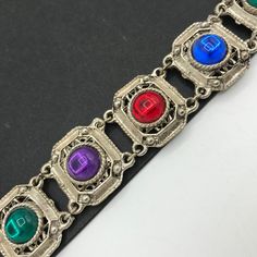 156.00 USD ❘❘❙❙❚❚ ON SALE ❚❚❙❙❘❘ Colorful Purple Blue Red Green Lucite rhinestone MOGUL jelly belly style bracelet, GRIPIOX collectible costume jewelry Very nice colorful Lucite rhinestone collectible vintage bracelet in good vintage condition. Measures 8 inches long by 1 inch wide. A perfect addition to any collection. #colorful #lucite #mogul #rhinestone #bracelet #jewelry d37 Vintage Multicolor Jeweled Bracelets, Antique Jeweled Bracelets For Party, Vintage Silver Costume Jewelry, Multicolor Costume Jewelry Bracelets With Jewels, Costume Jewelry Jeweled Bracelets For Gift, Multicolor Jewel Costume Jewelry Bracelets, Jeweled Costume Jewelry Bracelets For Gift, Retro Metal Jewelry, Retro Rhinestone Jewelry For Gifts