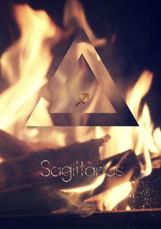 a fire with the words sagitrators written on it in front of some flames