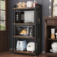 a microwave oven sitting on top of a wooden shelf