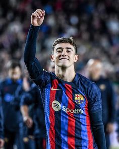 a soccer player is celebrating his team's win in the match between barcelona and real madrid