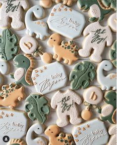 baby shower cookies with elephant and giraffes on them for a boy or girl