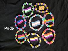 Kandi style bracelets for different pride flags <3  different sizes Matching Bracelets For 6 Friends, 100 Kandi Bracelets, Normal Bead Bracelet Ideas, Kandi Bracelets No Words, Rave Kandi Bracelets Love & Path, Kandi Bracelet Sets, Pride Pony Bead Bracelets, Kandi Pride Flag, Pride Bracelet Ideas