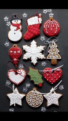 christmas cookies and decorations are arranged on a table