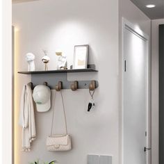 a bathroom with a towel rack, potted plant and radiator on the wall