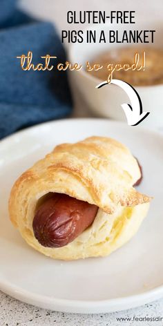 a close up of a hot dog on a plate with text overlay reading gluten - free pigs in a blanket that are so good