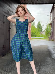 "Adorable and fresh for Fall 1950s Fit and Flare Navy and green plaid day or evening dress with full skirt and nipped waist. In excellent condition with no flaws of note. Does not include original belt. Back metal zipper with hook and loop. Has a tag but the writing is illegible Measurements Bust 36\" Waist 25\" Hip Free Length 43\" Please message me with questions before purchasing All sales are final and ship fast from the Vermont shop Find us on Instagram @anasclosetfullofcolor Thankyou!" 1950s Style Sleeveless Green Dress, Sleeveless Blue Dress For Vintage Fashion, Green Sleeveless Retro Vintage Dress, 1950s Style Green Daywear Dresses, 1950s Style Green Dresses For Daywear, 1950s Green Dresses For Daywear, Green Knee-length Vintage Dress For Vintage Fashion, Retro Sleeveless Vintage Dress For Daywear, Retro Green Vintage Dress For Daywear