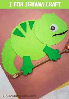 an image of a paper cut out of a frog on a branch with the words iguana craft