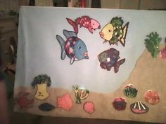 a painting with fish and plants on it