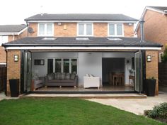 a house with an outdoor living area and patio