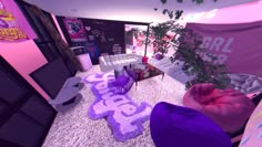 the room is decorated in pink and purple colors with decorations on the floor, including bean bags