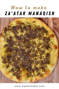 a close up of a pizza on a wooden surface with text overlay that reads how to make zaata manaoush