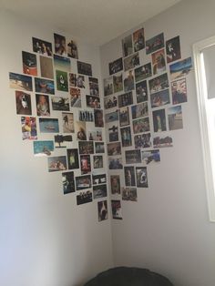 a room with pictures on the wall and a bed