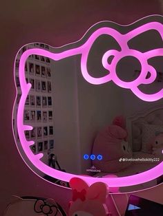 a hello kitty light up mirror in a room