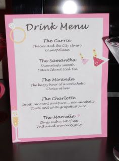 a pink drink menu sitting on top of a table